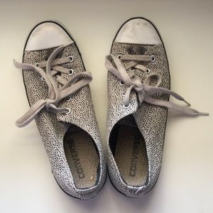 Black and white spotted converse